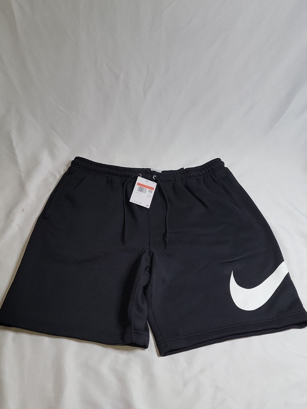 Nike Men's Black Athletic Shorts with Large White Swoosh